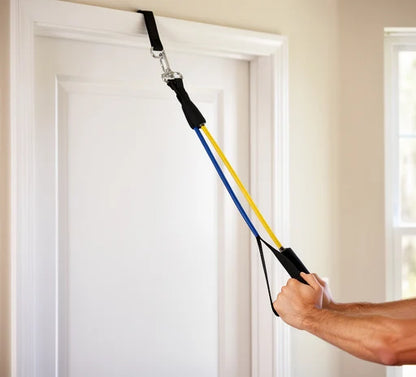 Resistance band set in use during a row exercise with a door anchor
