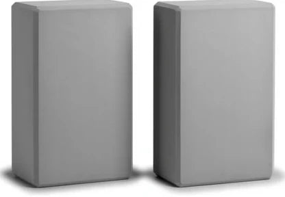 Two EVA foam yoga blocks standing upright side by side